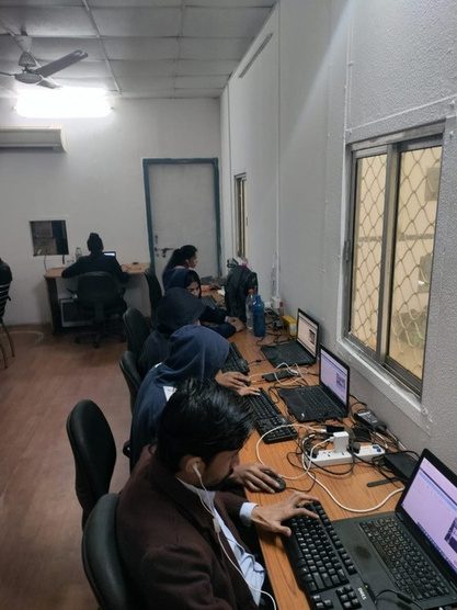 Students at computers during an AAKAAR digital literacy session